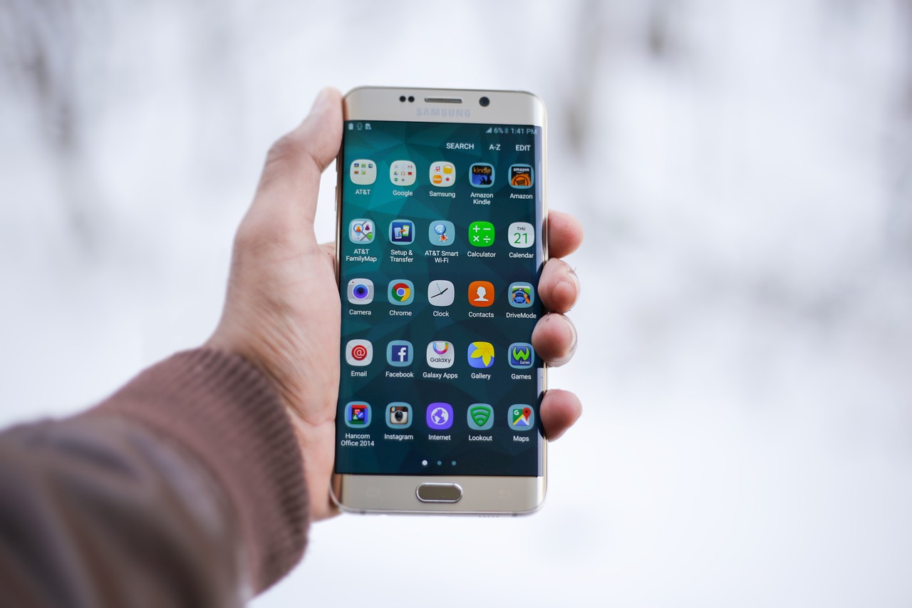Image of man holding smartphone.